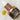 bottle with dropper of facial oil laying down on a counter tops with drops of oil