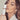 Pretty model with makeup holding a bottle of rescue serum in her hand up to her face