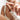 Close up of a models hand holding a bottle of rescue serum by osmosis