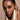 model looking at camera using mascara by osmosis