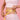 female model in pink is holding a measuring tape around her waste to promote weight loss with prism light pad