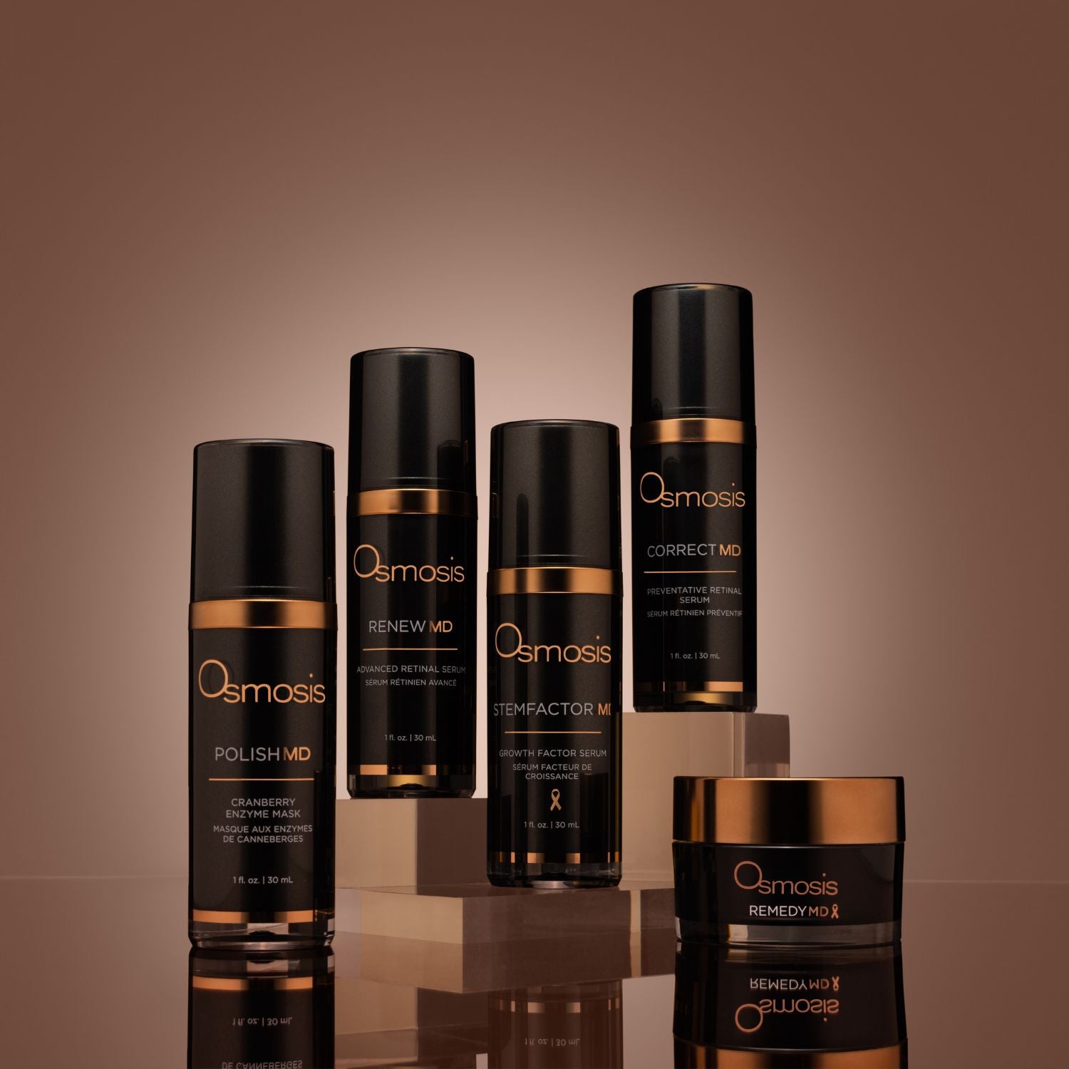 Five black and gold bottles of md advanced skincare collection by osmosis on display shelves 