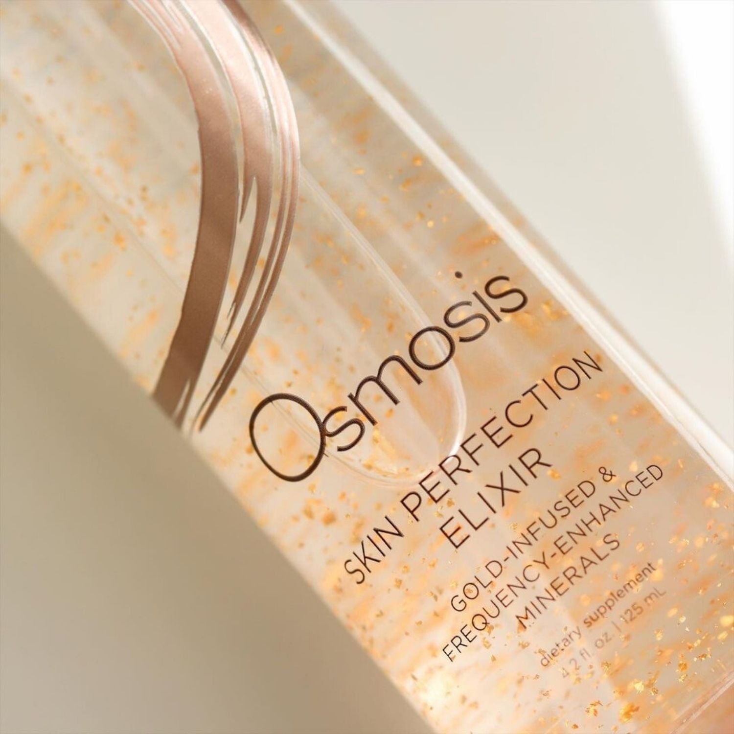 close up of skin perfection elixir with gold flakes