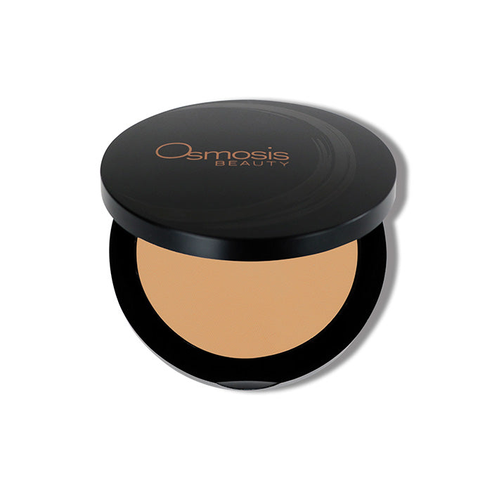 Pressed powder base natural dark Osmosis Beauty Makeup opened compact on white background